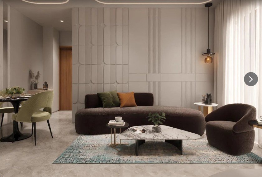 A warm, sculptural living room interior designed by Nakshatra Interior Design Studio